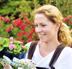 Woman with container-grown plants